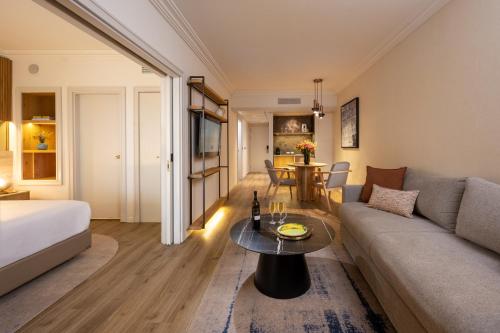 a living room with a couch and a table at Aria in Eilat