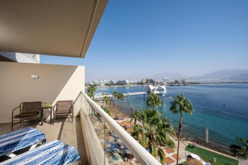 a balcony with a view of the water at Aria in Eilat