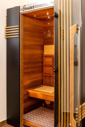 a sauna in a room with wooden walls at Biohof Abraham - Hofkäserei in Gossenreith