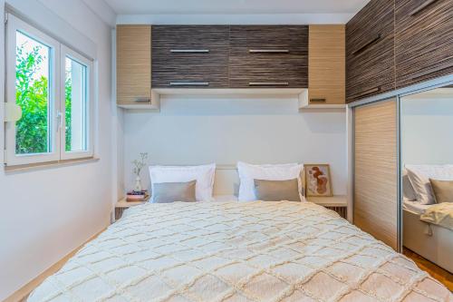 Postel nebo postele na pokoji v ubytování Beachfront apartment
