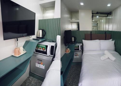a room with a bed and a flat screen tv at Cebu Backpackers Hostel in Cebu City