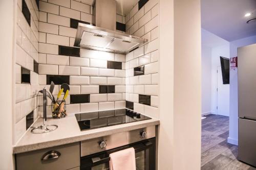 a kitchen with a sink and a counter top at York Crescent Apartments in York