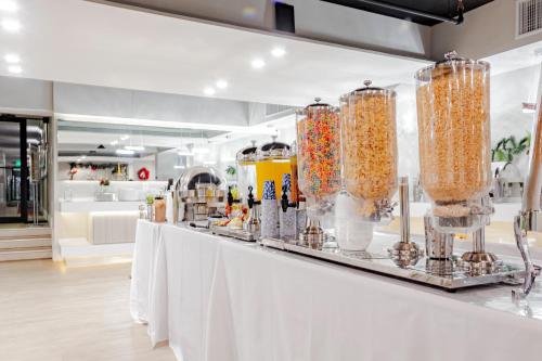 a store with a white counter with jars of food at Palazzo Lakeside Hotel in Kissimmee