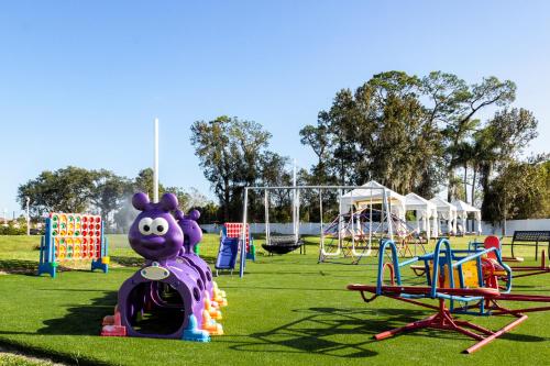 a playground with a purple rat on a train at Palazzo Lakeside Hotel in Kissimmee