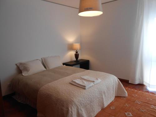 Katil atau katil-katil dalam bilik di Cacao Estoril Apartment