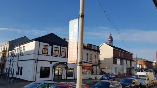 a street with cars parked in front of buildings at The Brema Hotel in Blackpool