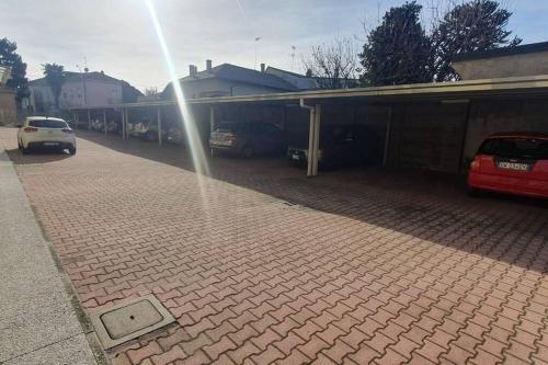 a water hose is spraying into a parking lot at Apartment near the airport station and city centre in Busto Arsizio