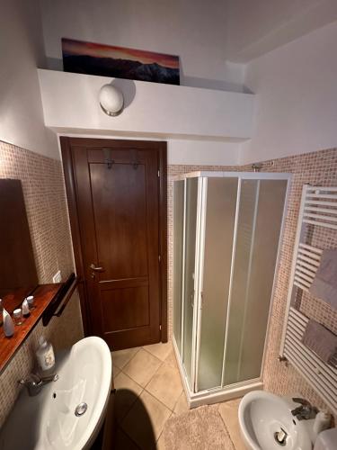 a bathroom with a shower and a sink and a toilet at La Loggia Luxury in Rocca di Mezzo