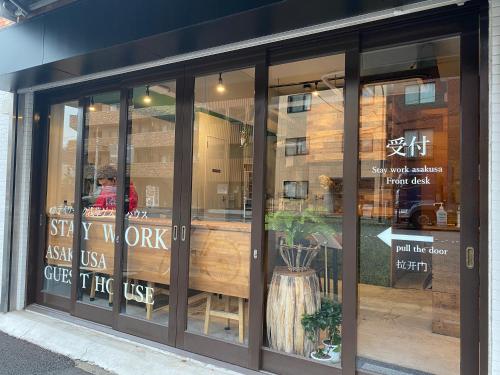 a store front window of a coffee shop at STAY WORK ASAKUSA guest house 浅草店 in Tokyo