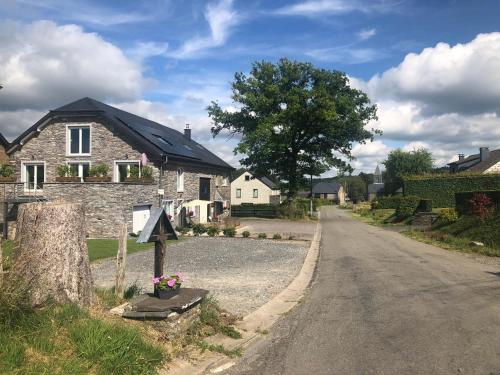 a house on the side of a road at PEGASUS I - 2 chambres de luxe, cuisine, salon, 2 terrasses et sauna in Vielsalm