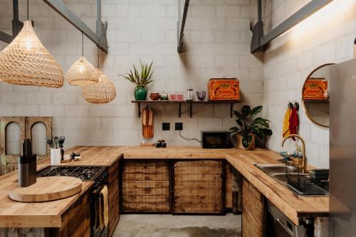 a kitchen with wooden counter tops and wooden cabinets at Sea Siren in Paternoster