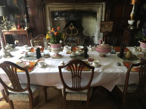 a table with a white table cloth on it at B&B Harlington Manor in Harlington