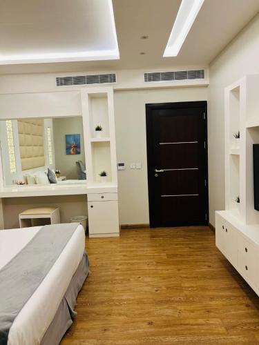 Postel nebo postele na pokoji v ubytování فندق تاورز - الفندقية