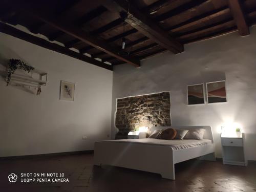 En eller flere senge i et værelse på Dante's Room dei Cerchi