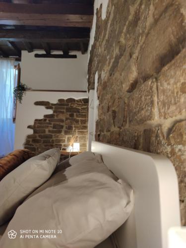 En eller flere senge i et værelse på Dante's Room dei Cerchi
