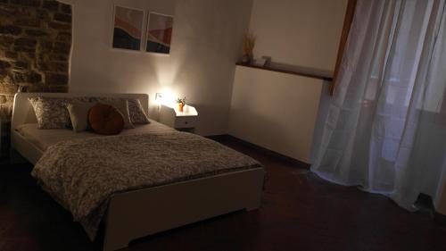 En eller flere senge i et værelse på Dante's Room dei Cerchi