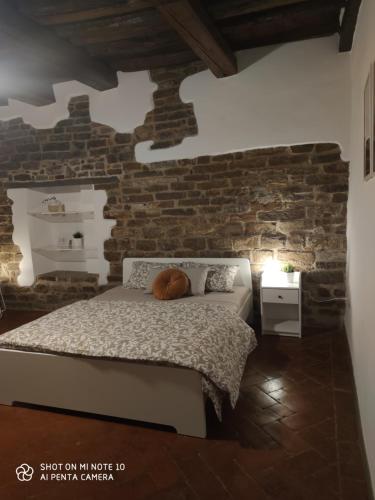 En eller flere senge i et værelse på Dante's Room dei Cerchi