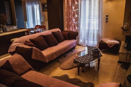 a living room with a couch and a table at Bojana' s luxury house in Larisa