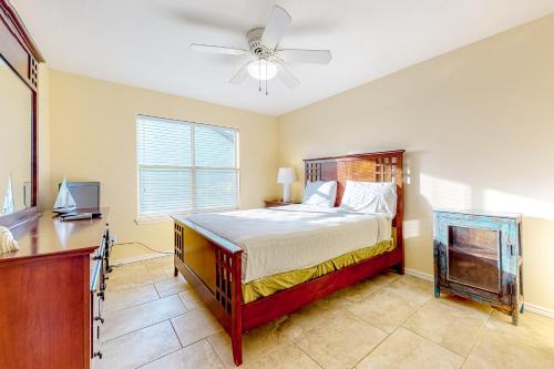 a bedroom with a bed and a ceiling fan at Beach House #0229 in South Padre Island