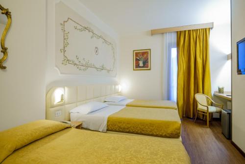 Ліжко або ліжка в номері Hotel Delta Florence