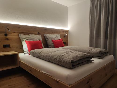 Ένα ή περισσότερα κρεβάτια σε δωμάτιο στο Appartements Stoll