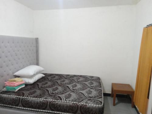 Ένα ή περισσότερα κρεβάτια σε δωμάτιο στο Tui Homestay