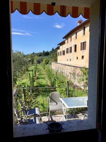 a view from a window of a room with a table and chairs at Agriturismo Cervano in Toscolano Maderno