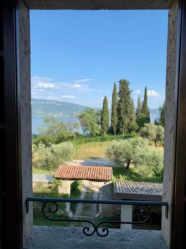 a view from a window with a view of a garden at Agriturismo Cervano in Toscolano Maderno