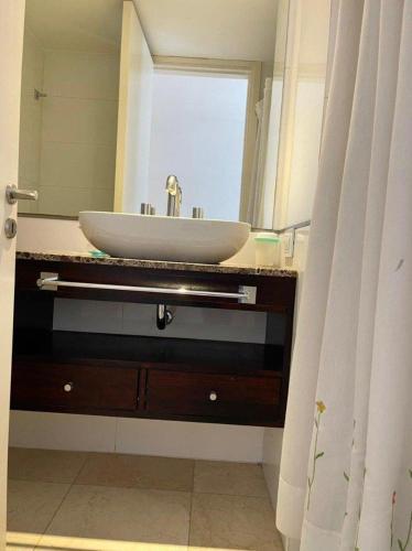 a bathroom with a sink and a mirror at deptomardel_playa in Mar del Plata