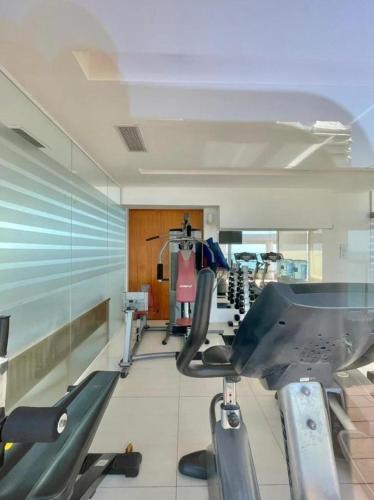 a gym with two chairs and a mirror at deptomardel_playa in Mar del Plata