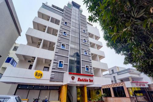 a tall building with a marriott sign in front of it at Itsy Hotels Buddha Inn in Patna