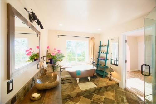 a bathroom with a tub and a sink at Magical Bay View in Oakland Hills in Oakland