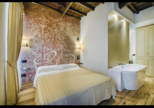 a bedroom with a bed and a sink at Luxury Ripetta 2 in Rome