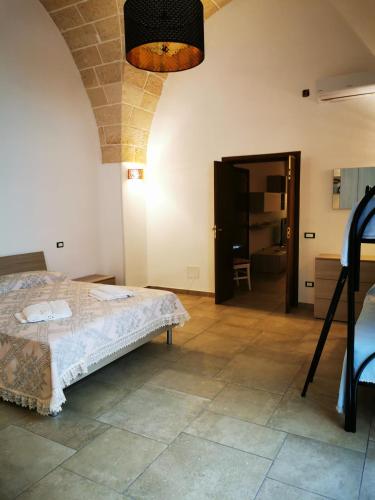 a bedroom with a bed in a room at LA VECCHIA TORRE 1920 in Grottaglie