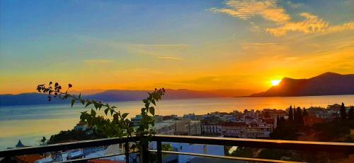 a view of the sunset from a balcony at Mitho Hotel Spa in Loutra Edipsou
