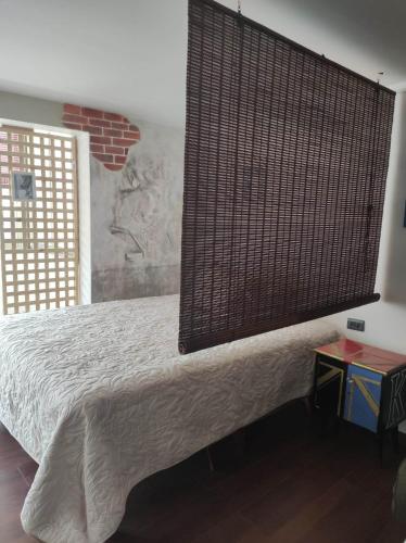a bedroom with a bed and a large window at Estudio21centro in Arica