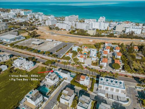 an aerial view of a city with the ocean at Tsolias Apartments in Protaras
