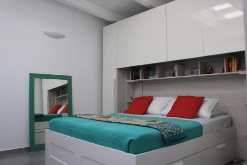 a bedroom with a large bed and a mirror at La Quintecita villa con piscina privata - vicino Catania e Etna in San Giovanni la Punta