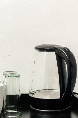 a black appliance sitting on top of a counter at Nkosazana Guest House in Durban