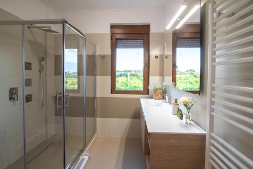 a bathroom with two sinks and a shower at Cretan Vineyard Hill Villa 2 in Áno Kalésia