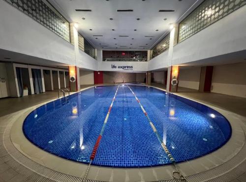 a large swimming pool in a large building at Your home in istanbul in Istanbul