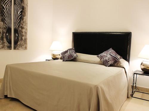 a bed with two pillows on it in a room at L'Etoile in Foggia