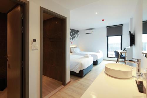 Cama o camas de una habitación en KOO HOTEL