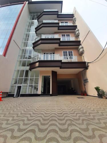 a building with a carpet in front of it at Kawa Living in Krukah