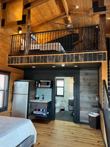 a bedroom with a bunk bed and a loft at Hideout on the Horseshoe in Canyon Lake