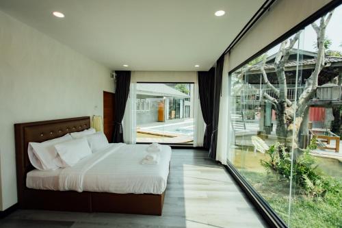 Ein Bett oder Betten in einem Zimmer der Unterkunft KEPT Cabana เคปท์ คาบานา