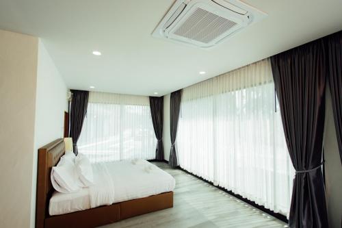 Ein Bett oder Betten in einem Zimmer der Unterkunft KEPT Cabana เคปท์ คาบานา