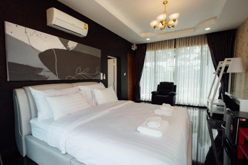 Ein Bett oder Betten in einem Zimmer der Unterkunft KEPT Cabana เคปท์ คาบานา