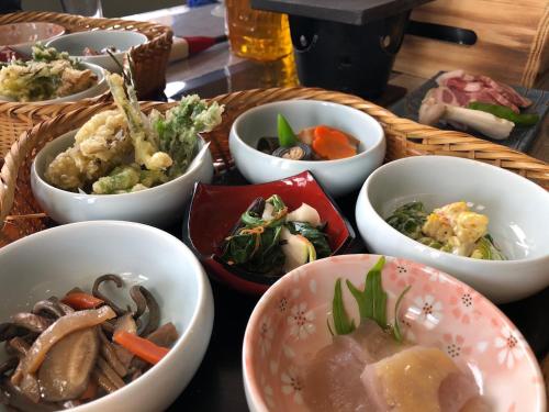 a group of bowls of food on a table at Bandai in Tokamachi