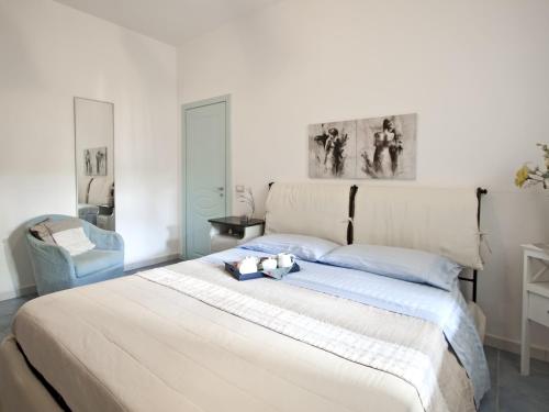 מיטה או מיטות בחדר ב-Terrazza a mare Corallo